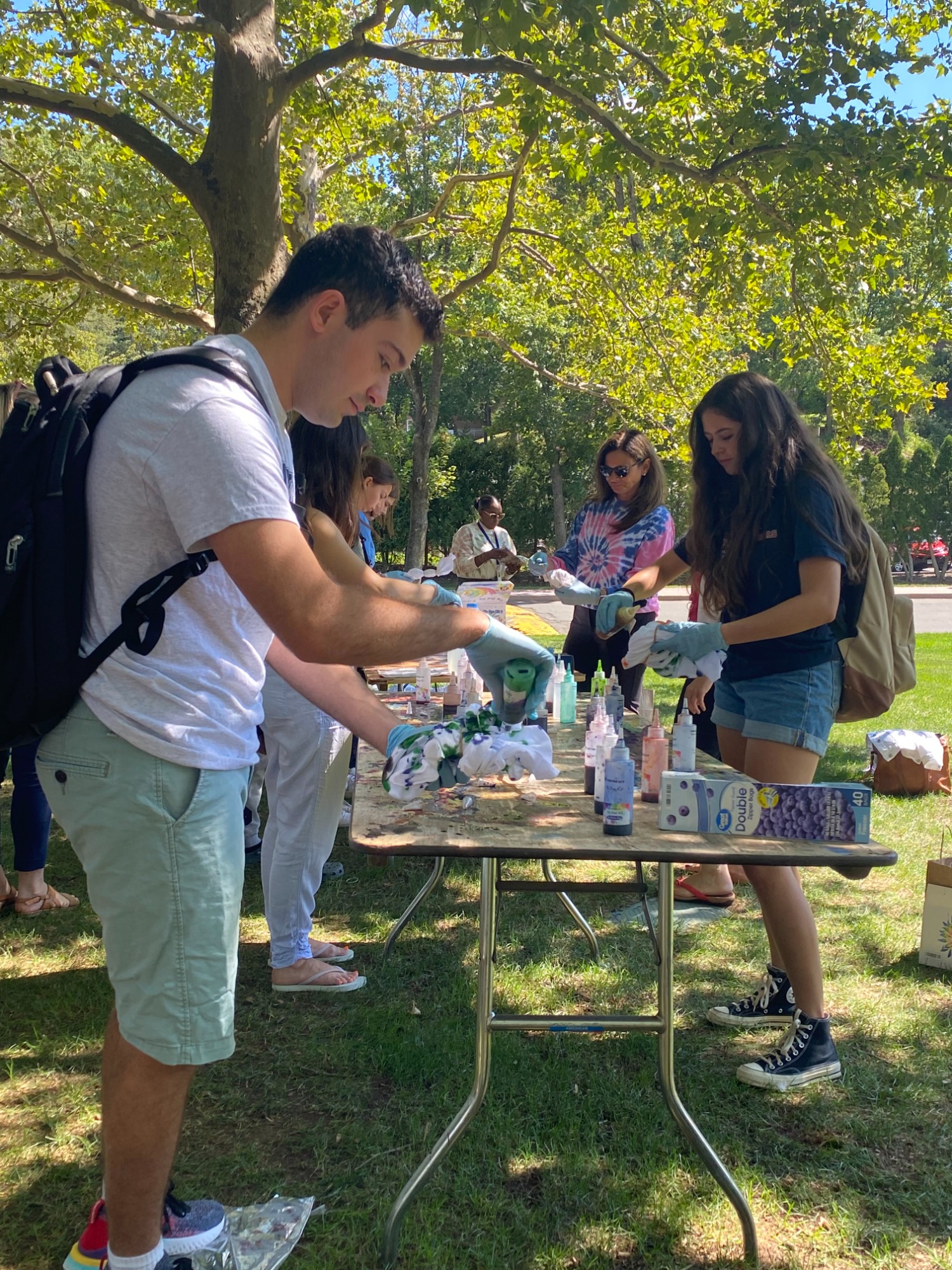 Quinnipiac University counselors were at a tie-dye station to raise awareness for suicide prevention. (Photo by Dalton Rice)