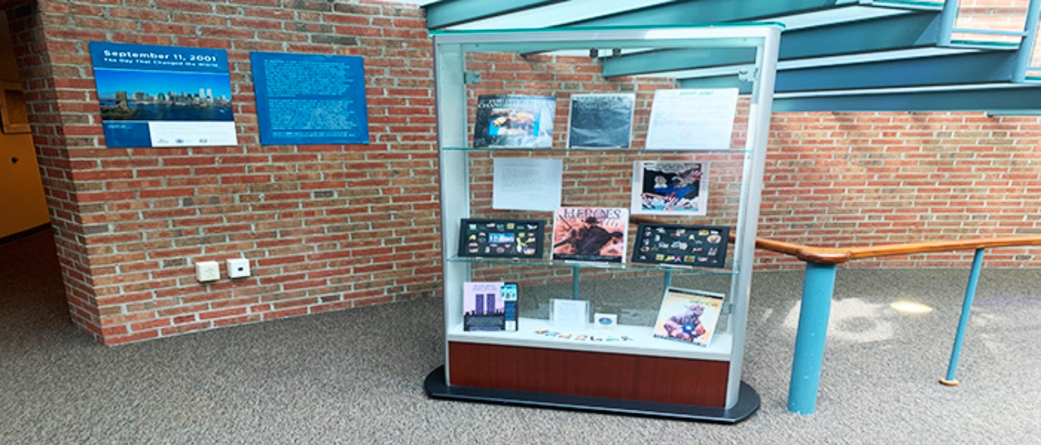 The other half of the 9/11 exhibit on display in the Arnold Bernhard Library. The exhibit also features pins, magazines and even a coloring book. (Photo by Andrew Marchitto)