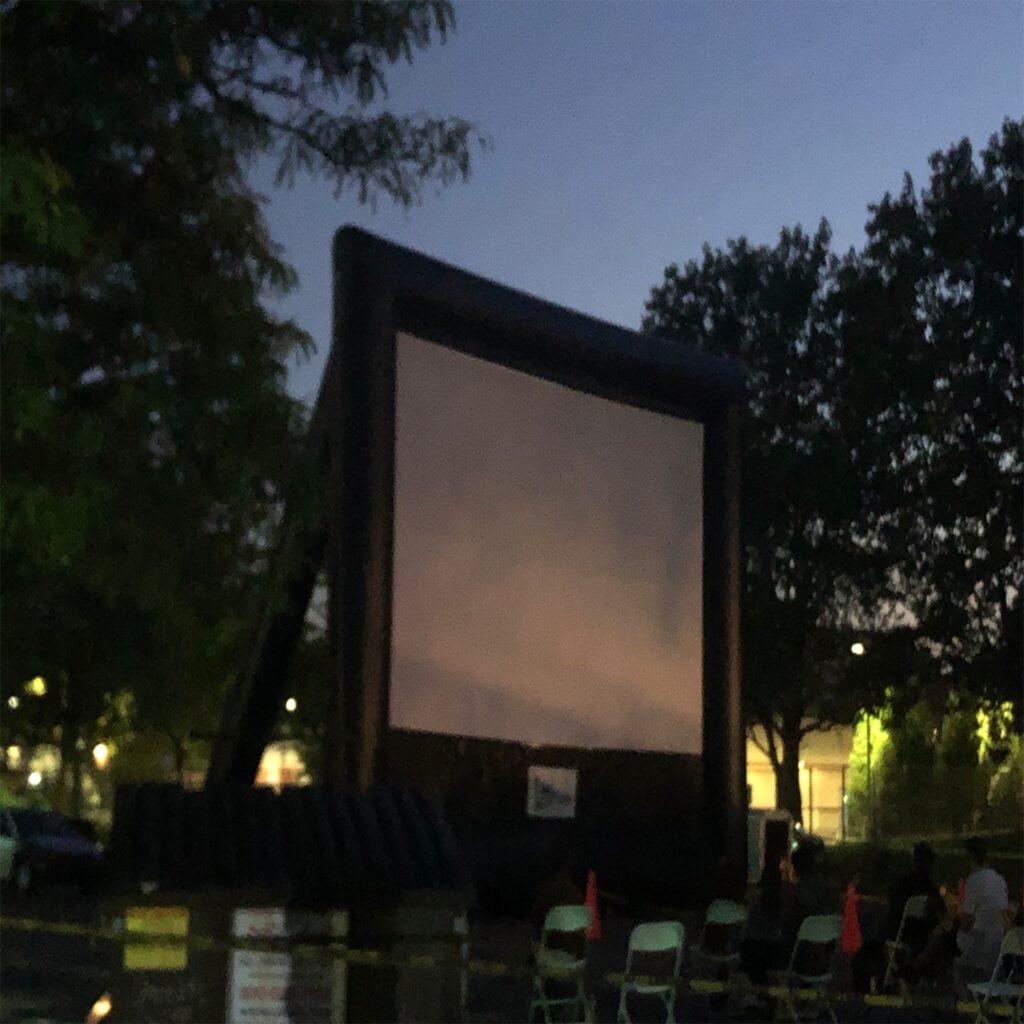 Teamwork - 30-foot screen erected by staffing