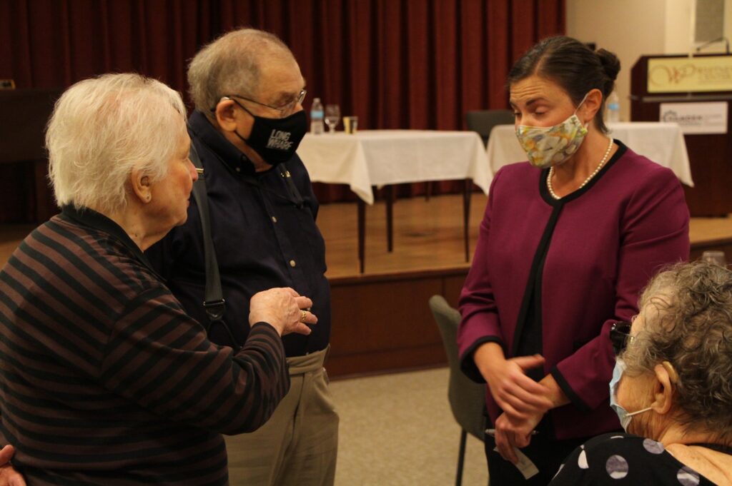Lauren Garrett(right) speaks with voters after the debate. Photo by Chatwan Mongkol.