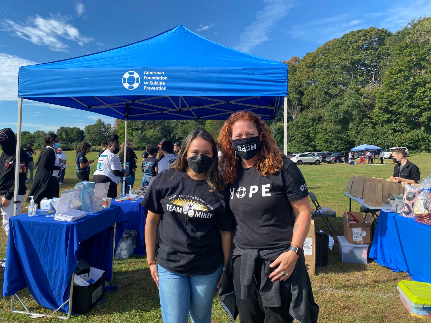 Kara Sepuvelda (left) and Michelle Peters (right) greet guests at the registration table during the Out Of The Darkness walk that took place this past Sunday in Hamden. Photo courtesy Dalton Rice