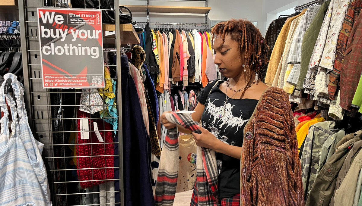 Jordyn Morris browses through the scarf section at 2nd Street in New Haven on March 22.