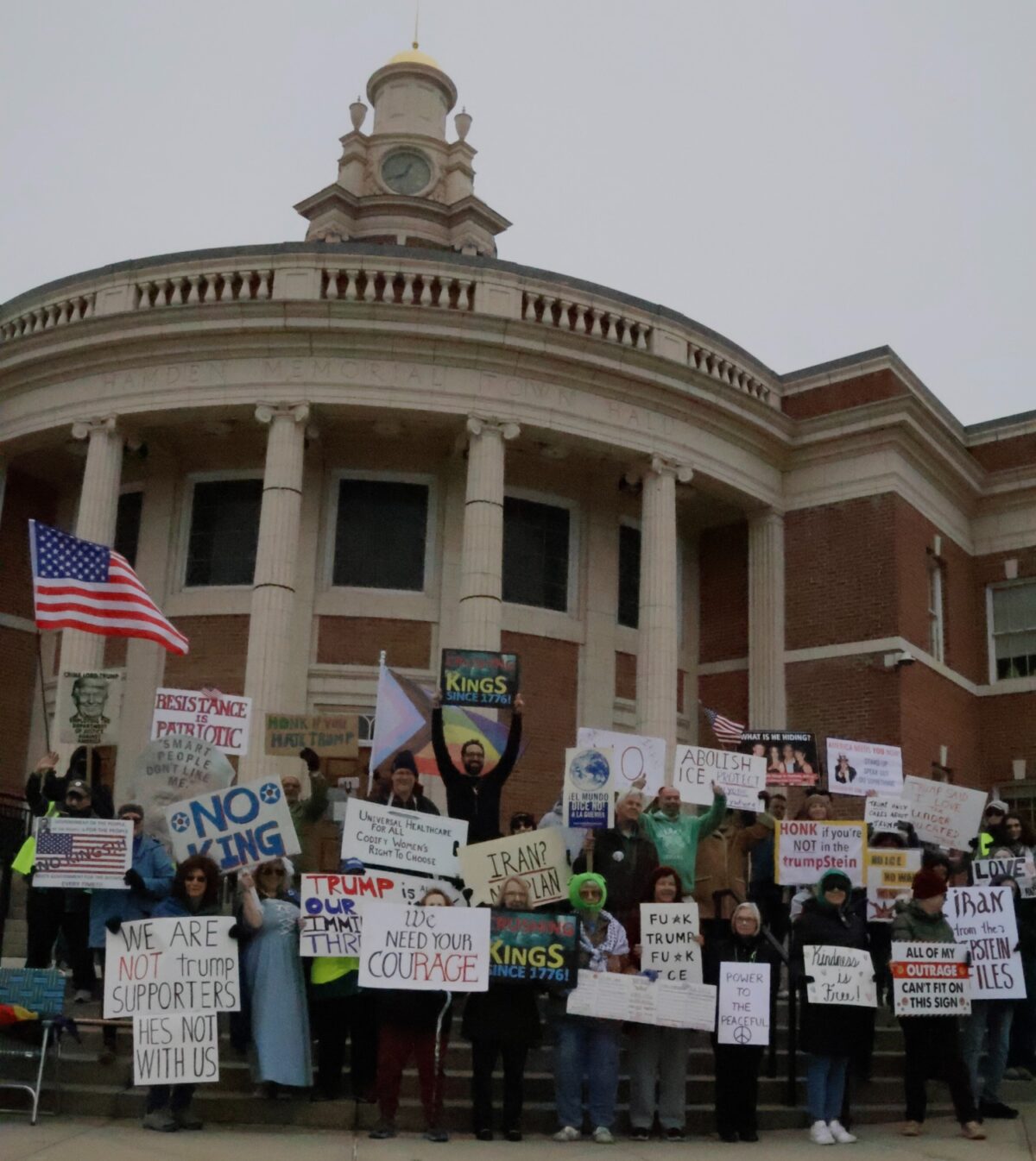 Protesters gather for a group photo at the conclusion of their weekly rally. Hannah Freshman/HQNN